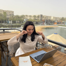 Rahma Ali working on laptop as a digital markter